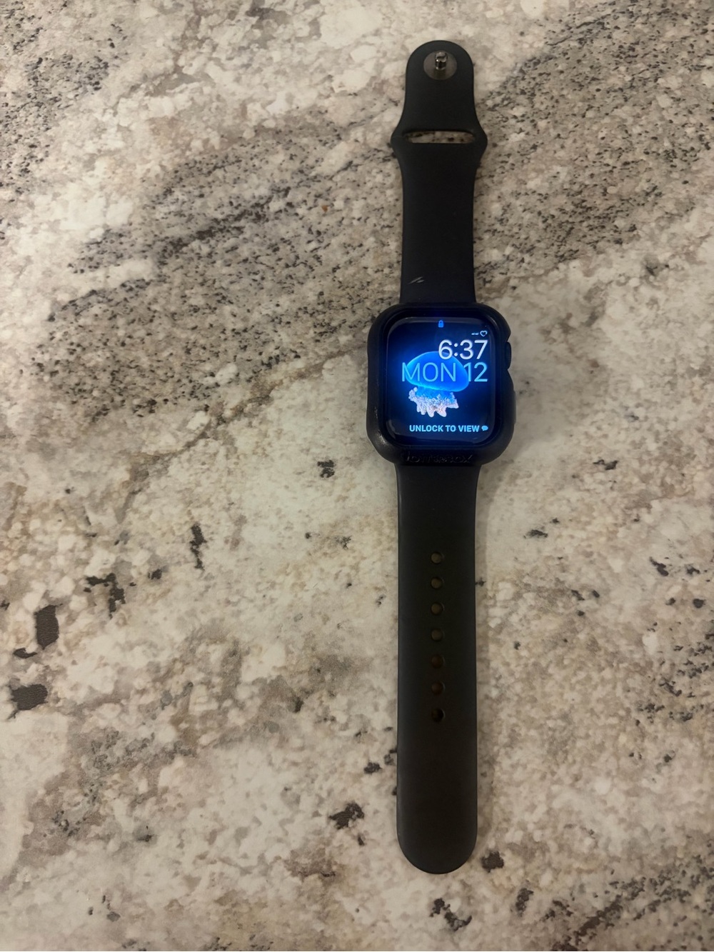 Apple Watch with Black Sport Band and otterbox Case